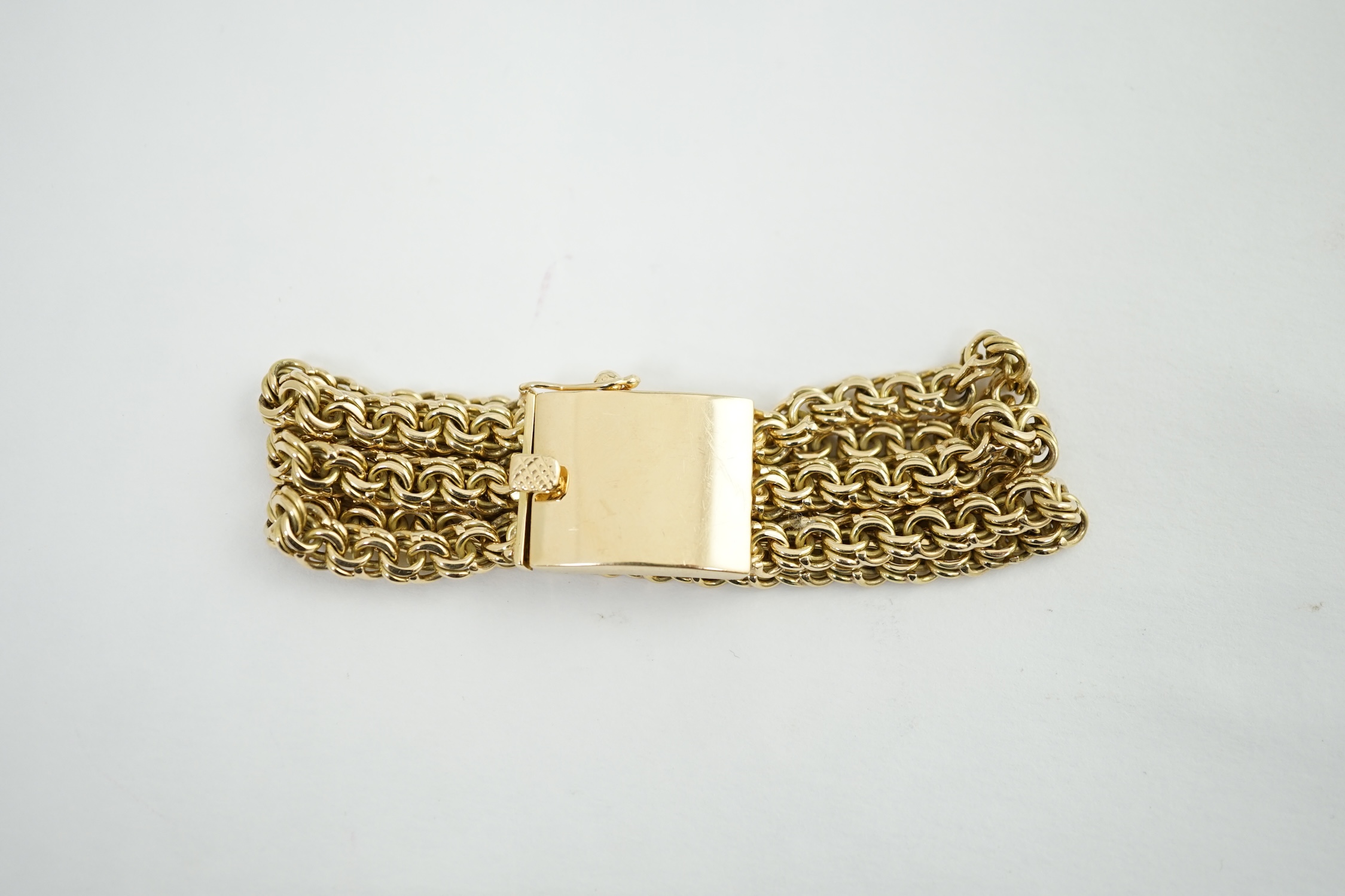 An 18k gold triple strand oval chain link bracelet